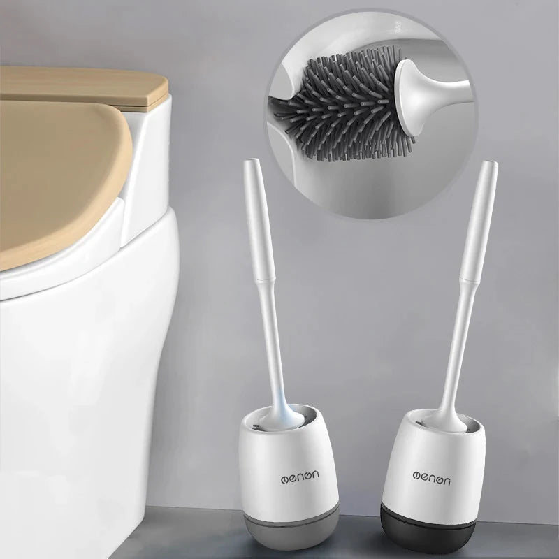 Two white toilet刷es with black bristles on a gray background, one with an inset showing the brush head.